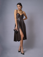 model wearing chocolate brown soft vegan leather dress with high thigh split