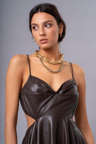 model wearing vegan leather chocolate brown dress, front detail